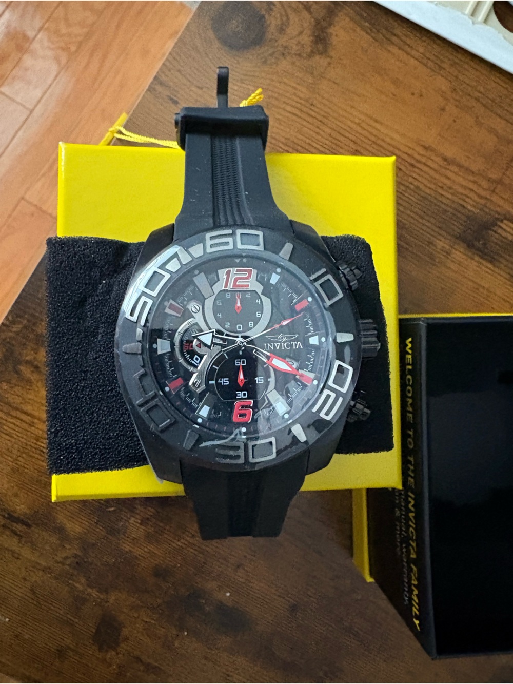 Invicta Black and Red Chronograph Sport Watch with Silver Accents